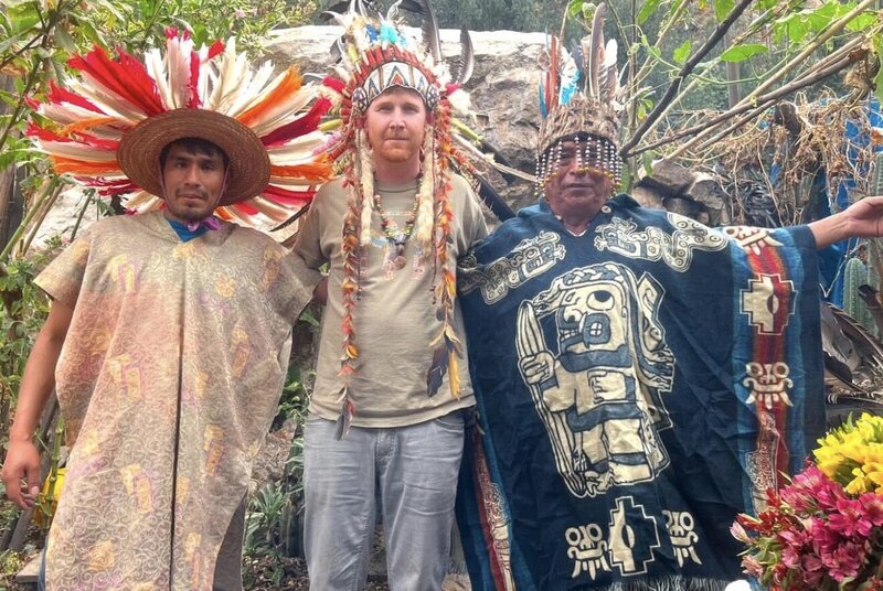 Daniel with people he met during his travels