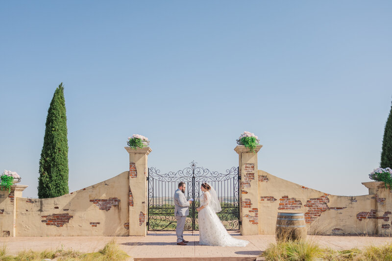 Private vows being exchanged at Villa Aletta outdoor ceremony space photographed by Claire Katan.