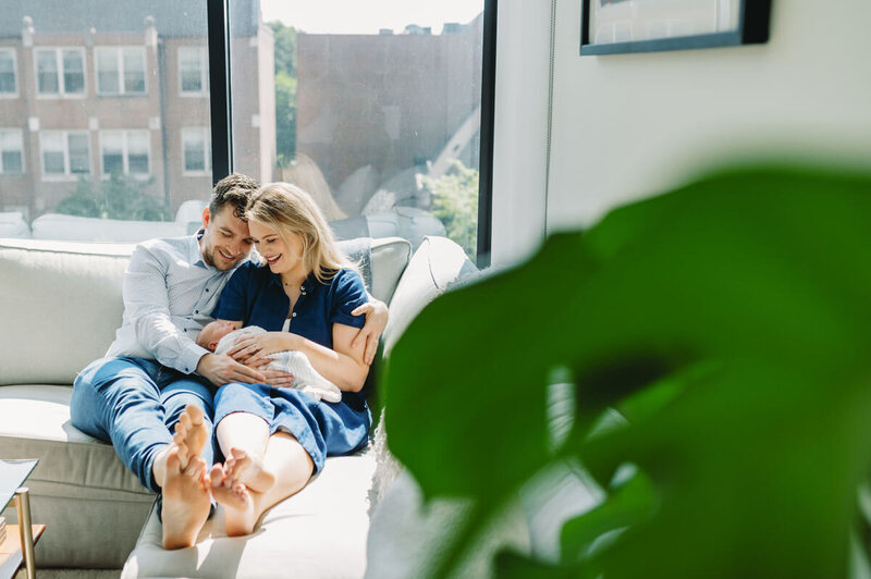 mom and dad holding newborn