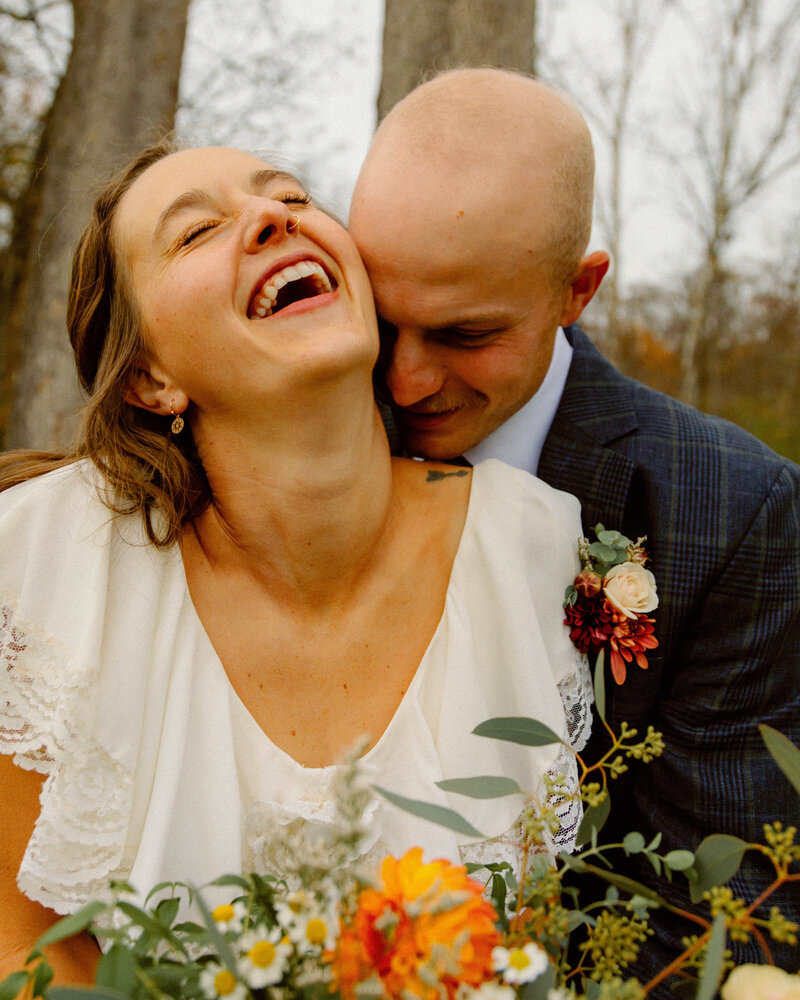 Children tossing flower petals in the air as they walk down the aisle during a wedding ceremony in Kansas City, captured in authentic, joyful, and emotional documentary style.
