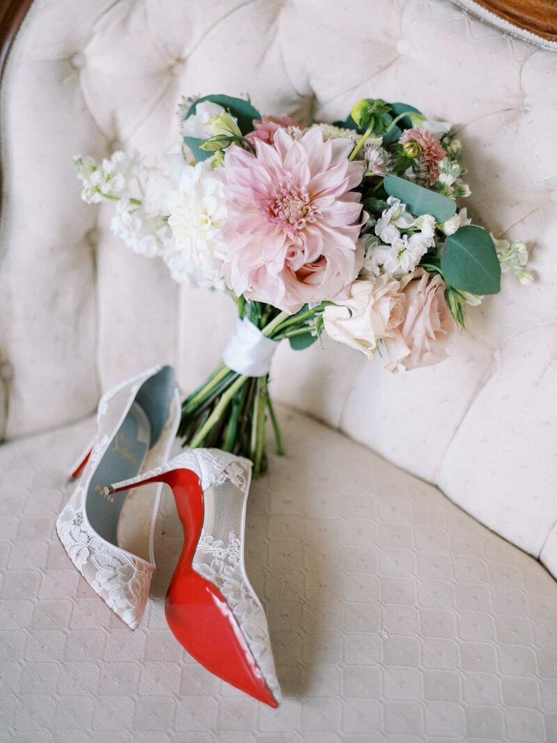 Brides red bottom shoes and bouquet at a Hudson Valley Wedding Venue