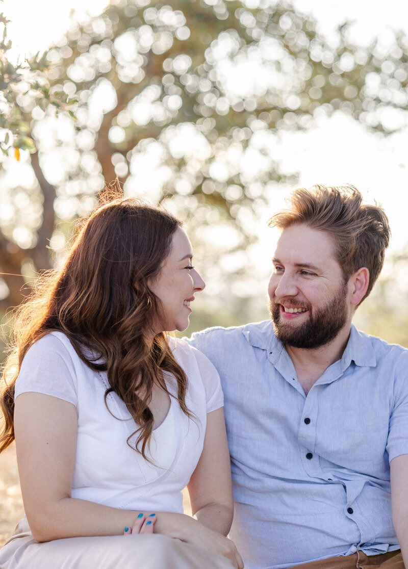 smiling-couple-golden-hour-photoshoot-oakgrove