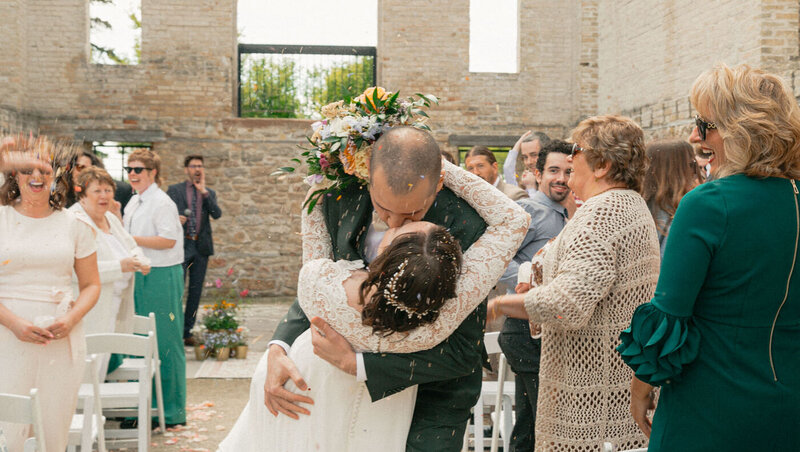 Bride and groom kissing after the ceremony