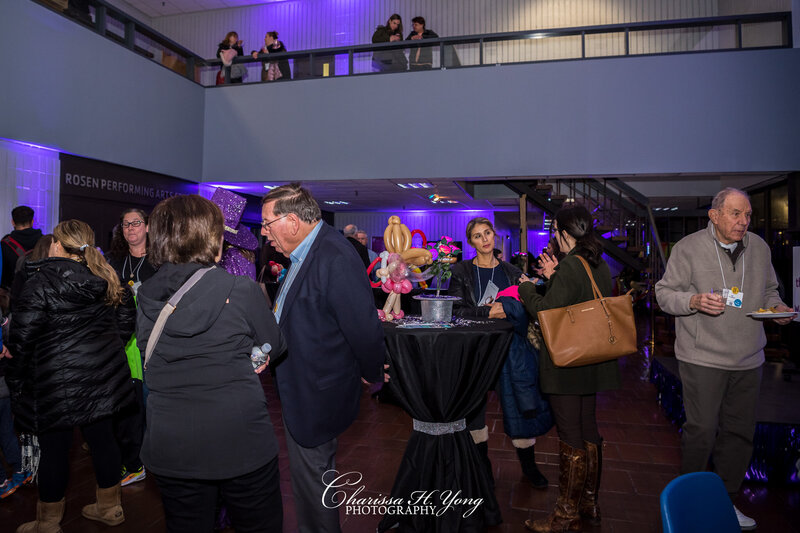Attendees are chatting with each other at the Wayne YMCA fundraising event.