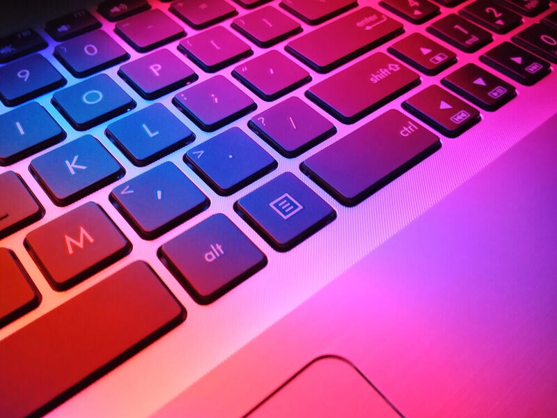 Computer Keyboard With Pink, Blue, and Red lighting