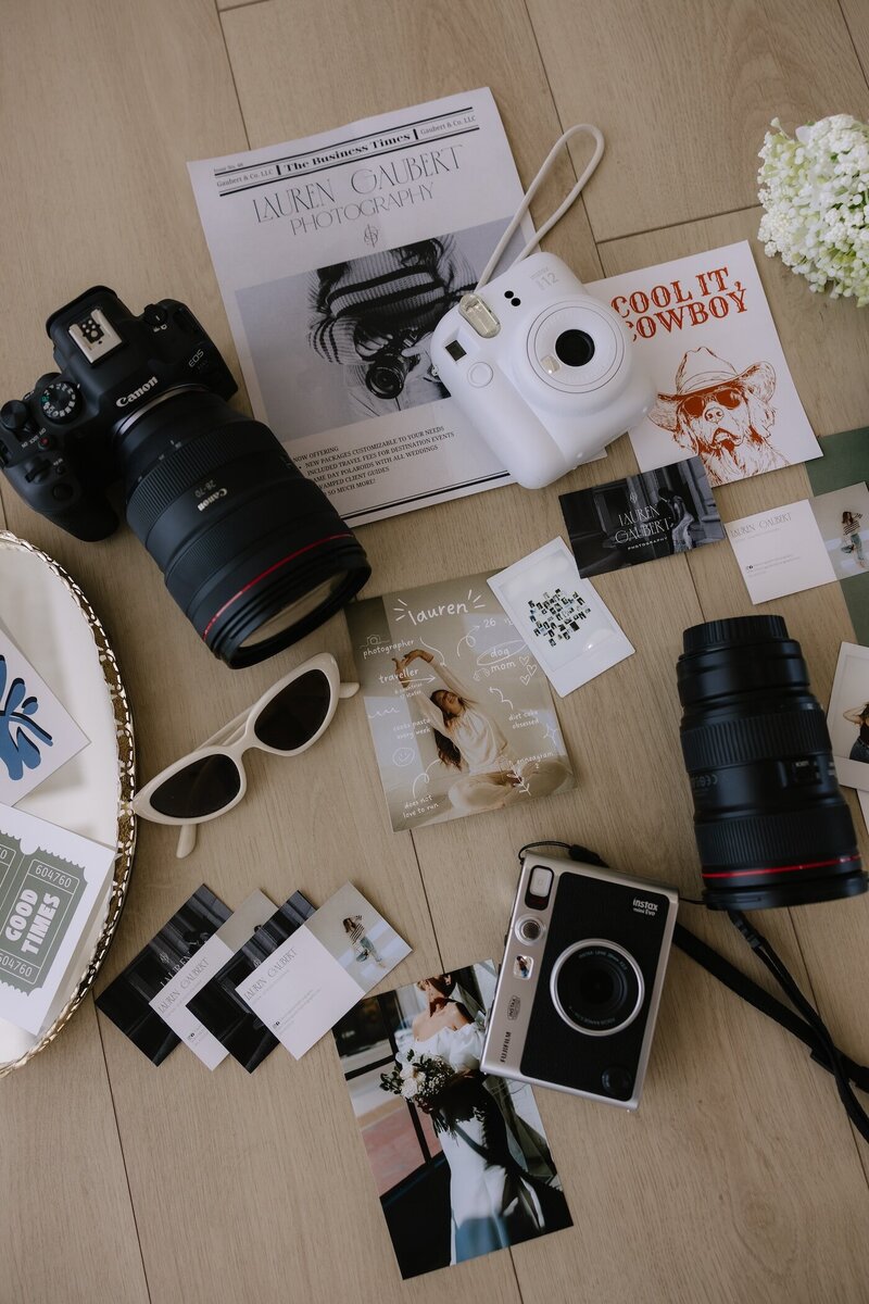 brand photo flat lay of cameras and photos for lauren gaubert photography
