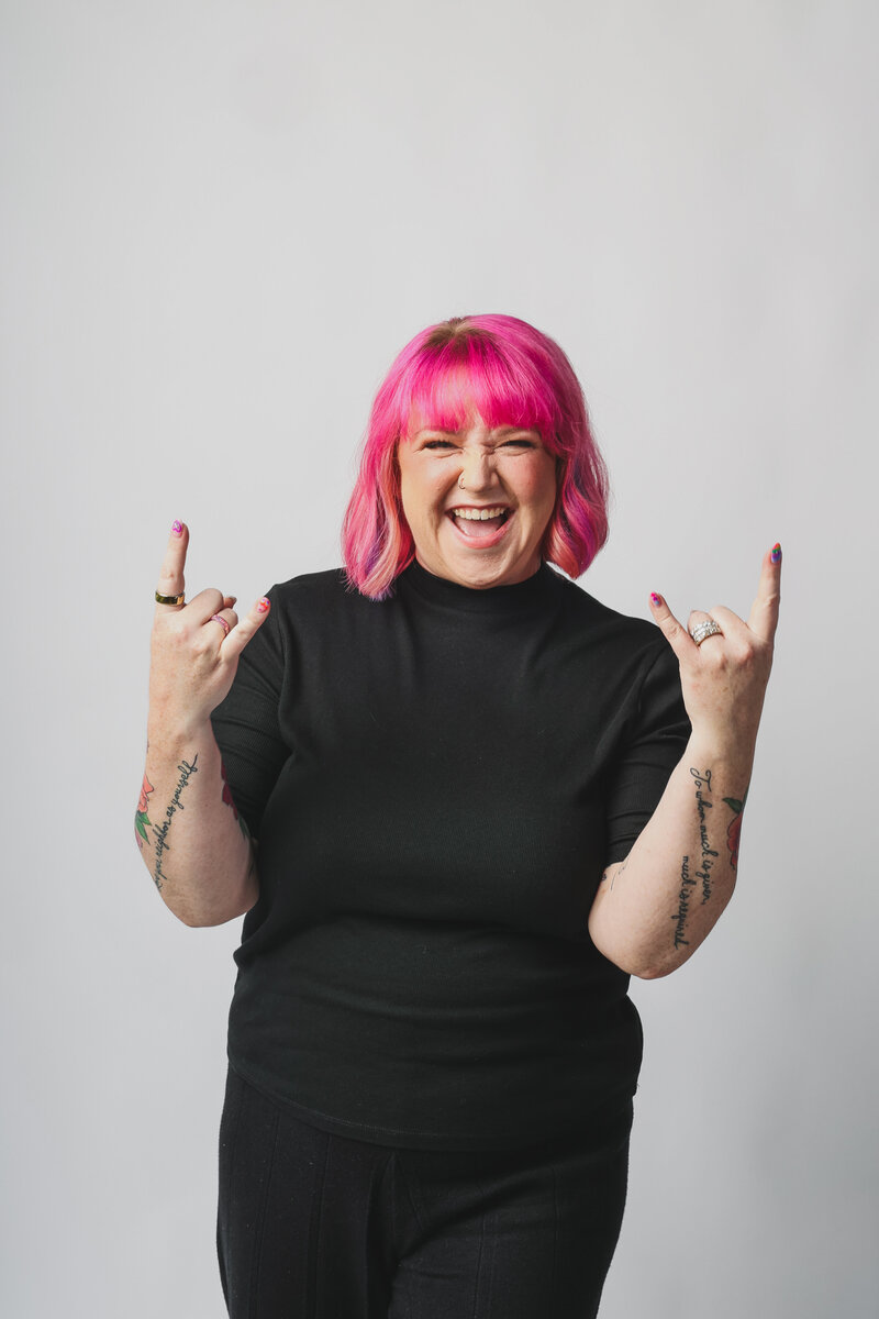 Ashley Ebert smiles while teaching a session to grow your wedding business