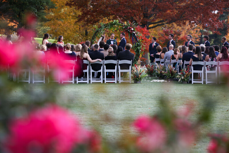A couple have a Asheville Wedding on the lawn at the Grove Park Inn :  Light Shifter Studios 