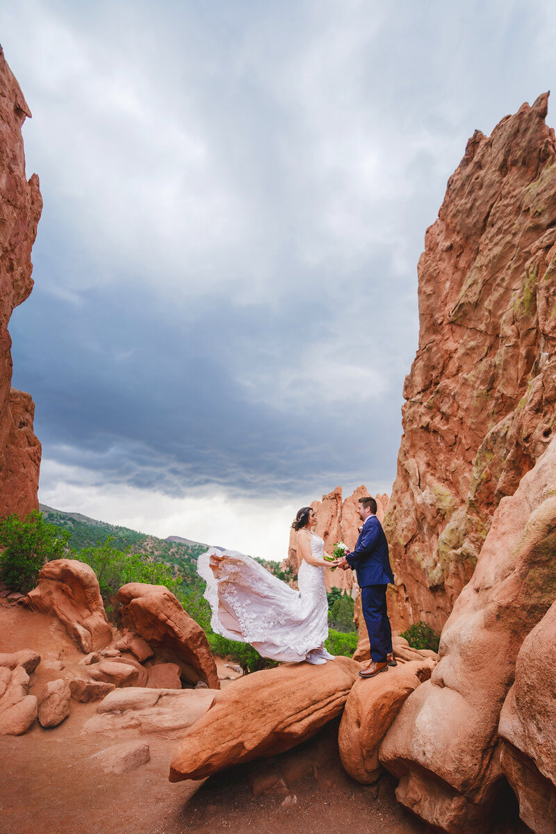 Colorado Elopement Photographer captures bride's dress blowing in the wind