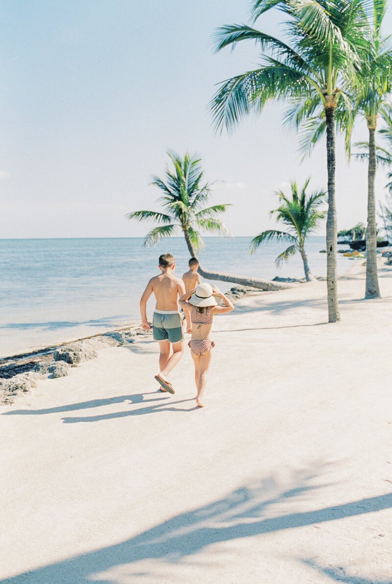 kids running on beach from  beginner photography course for moms