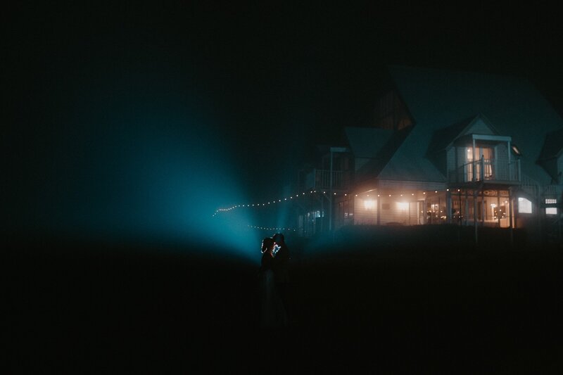 Night shoot with Bride and Groom outside Maleny Manor - lit up with fog in background