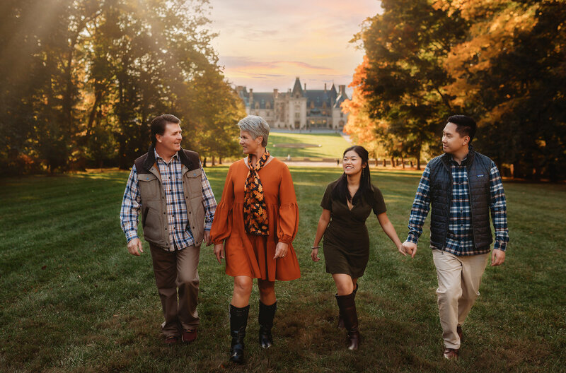 Family walks along the Blue Ridge Parkway together during a Fall Family Photoshoot in Asheville, NC.