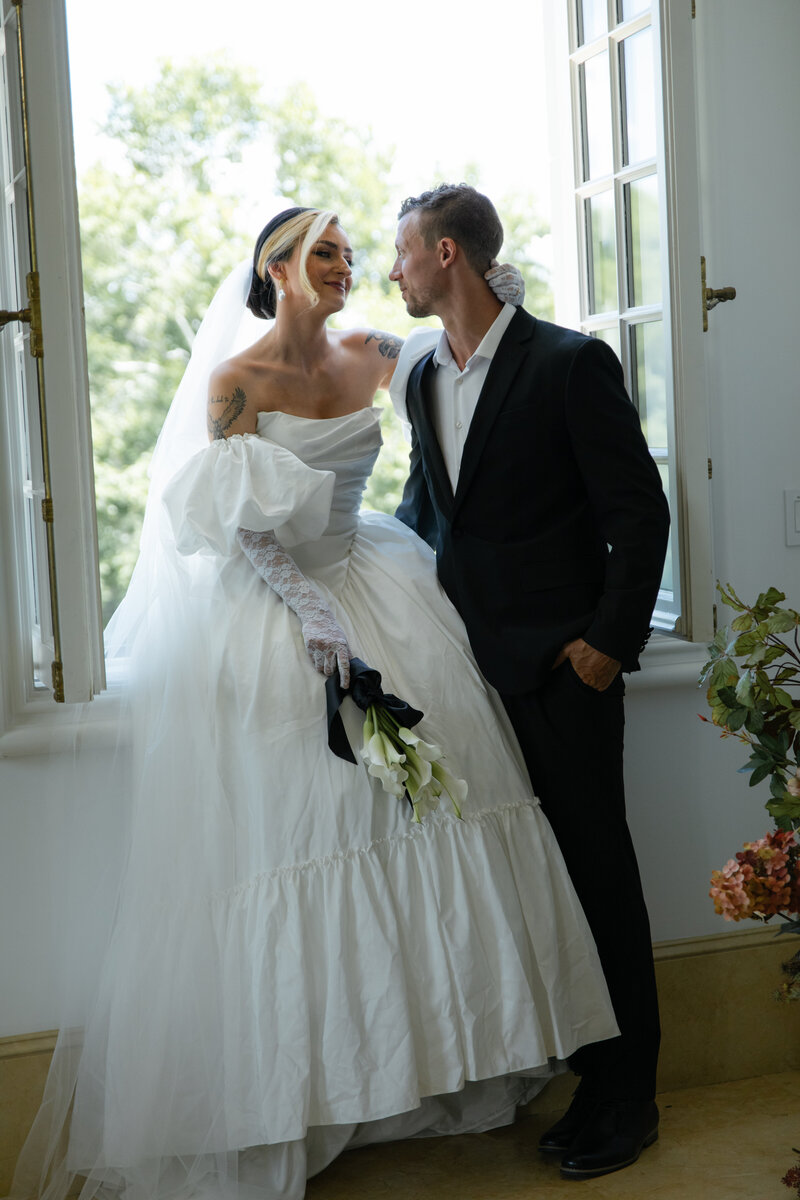 WEdding couples walking together laughing Morais Vineyard Virginia