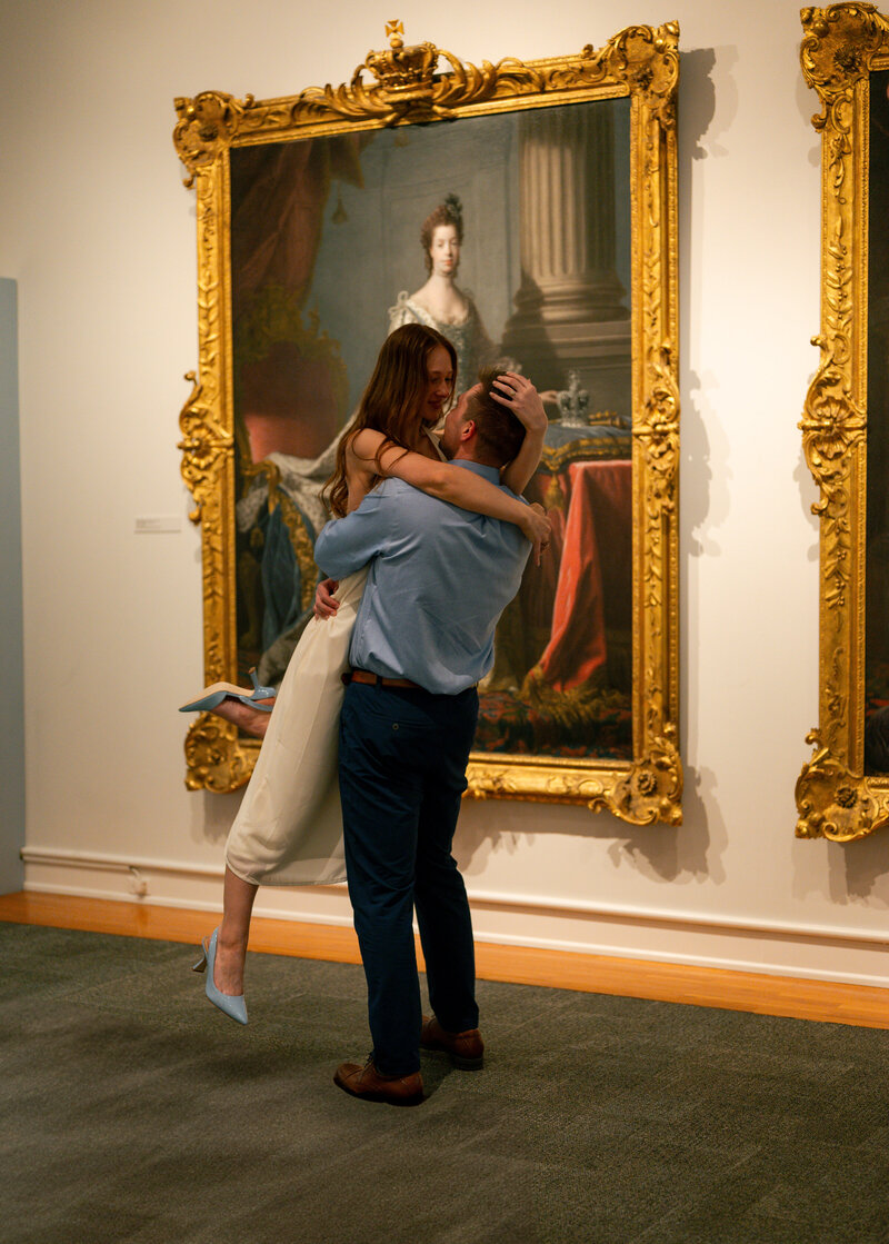 Bride and groom walking the steps of The Mint Museum in Charlotte