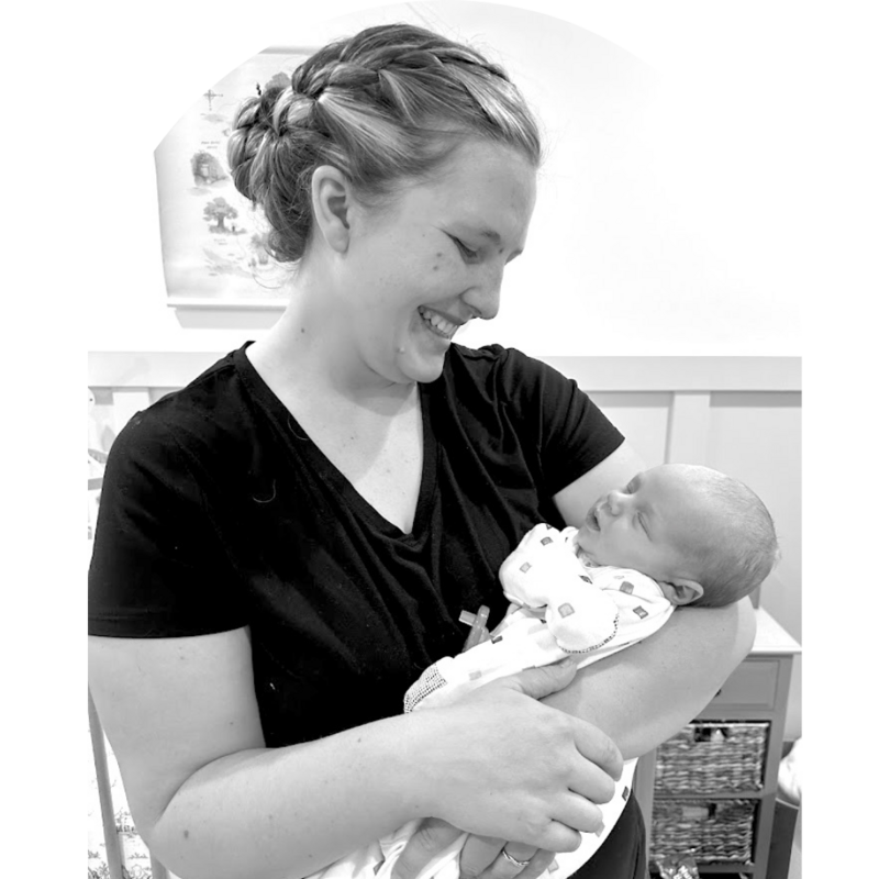 Utah Doula smiling and holding baby