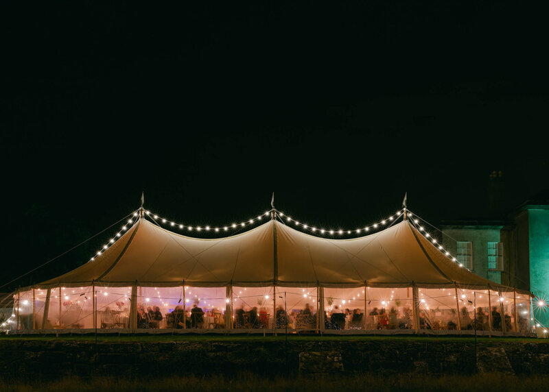 chloe-winstanley-weddings-sailcloth-tent-lights-night