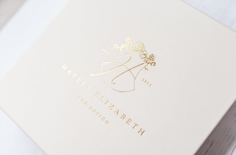 Gold logo on cream box in luxury branding project