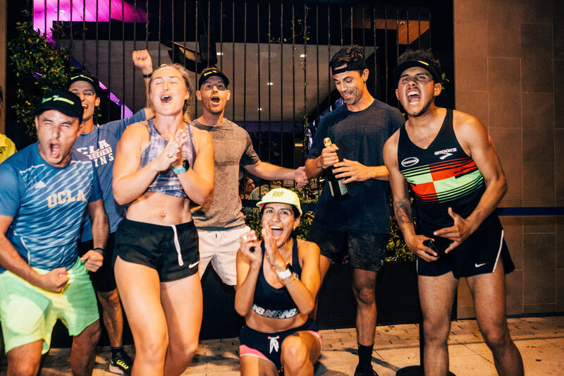 a group of people celebrating after a huge race. 