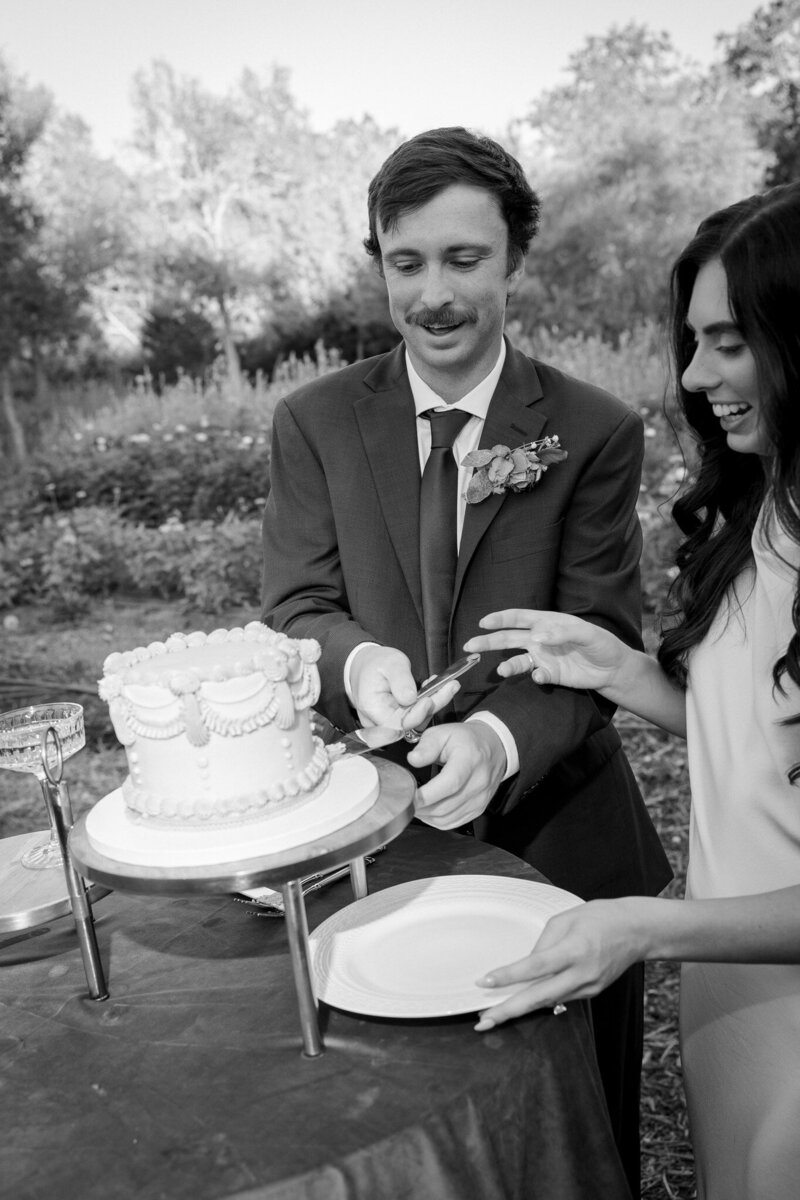 A nostalgic photo of a candlelit tablescape at a wedding reception captured by Southern California film and digital documentary wedding photographer