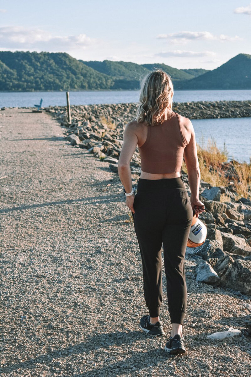 Stacie hiking near a lake