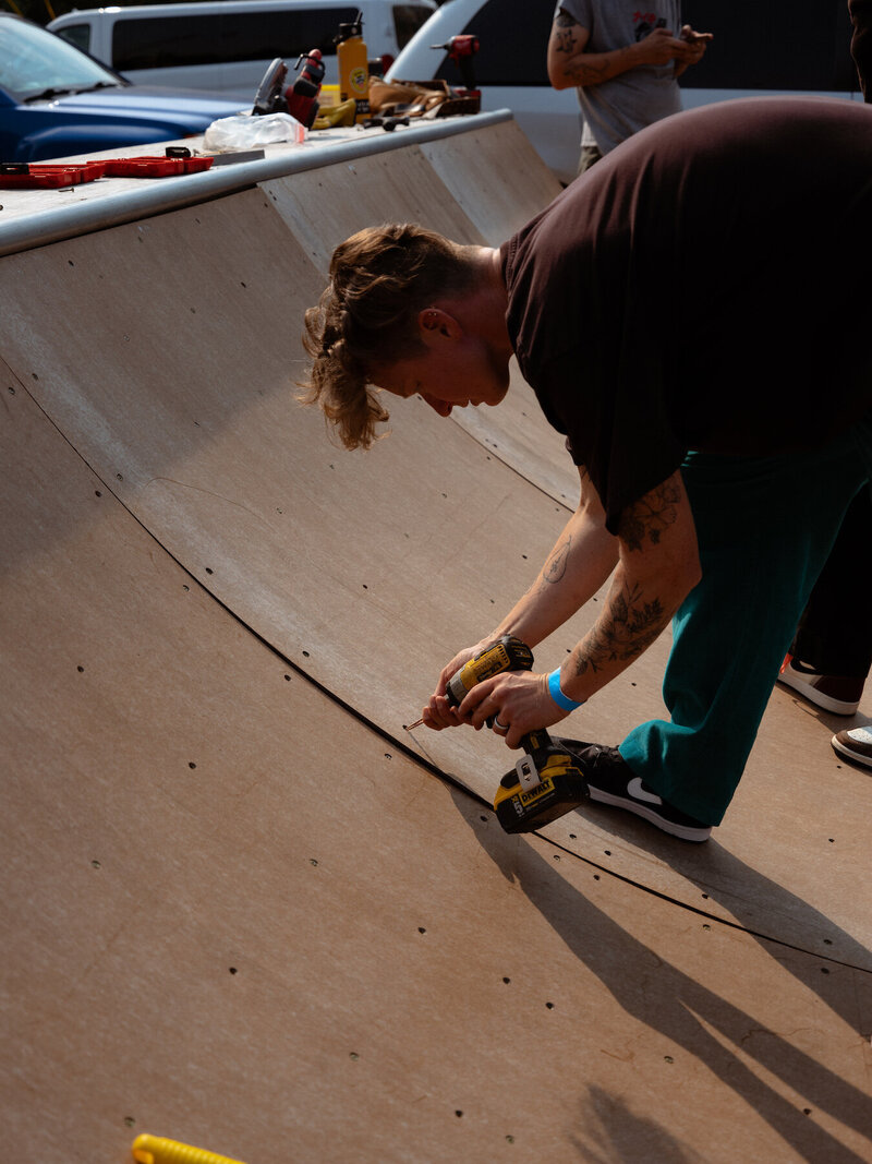Person building skate ramp