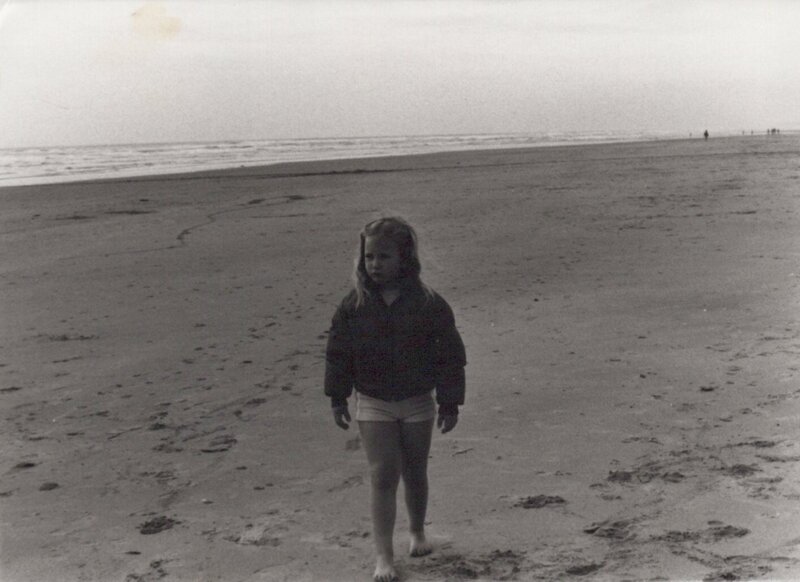 Tiny Bubble Athleisure Blog palm trees closeup little girl on the beach in a puffer jacket in the 1970s