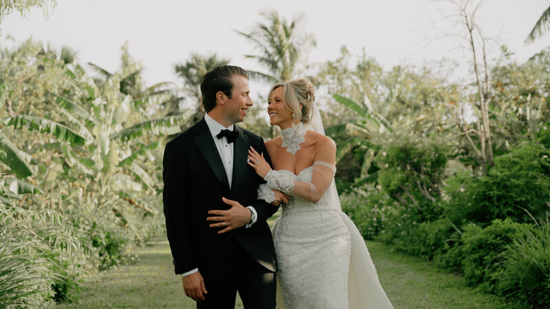 Couple walks hand in hand on their wedding day.