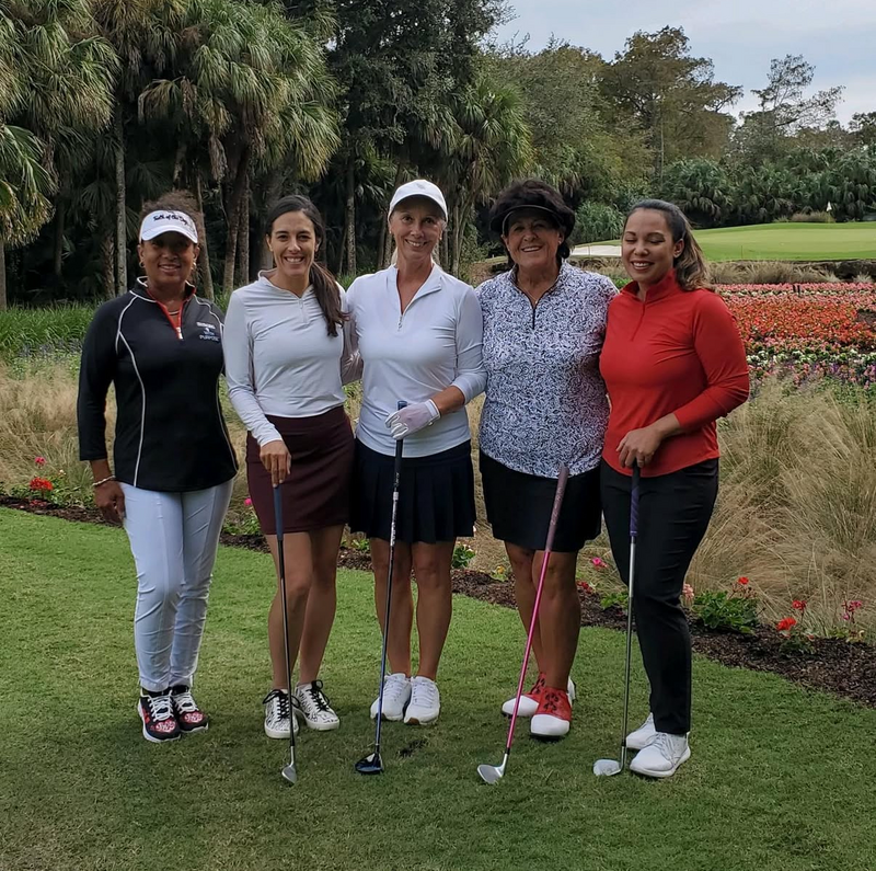 Renee O’Higgins, PGA and LPGA golf instructor with Nancy Lopez LPGA Tour professional and group playing golf at Quail West, Naples, Florida.