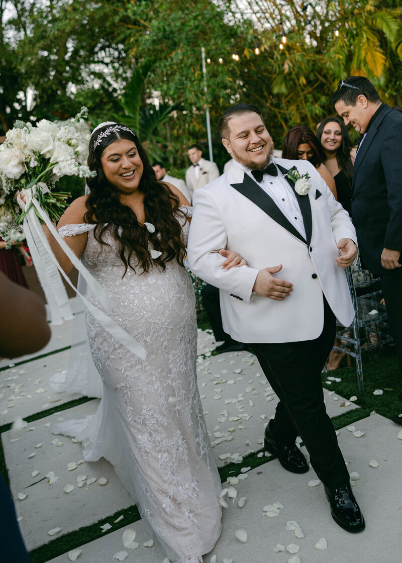 Couple exiting their wedding after saying yes to forever. Miami wedding photographer. Documentary style of photography based in miami florida