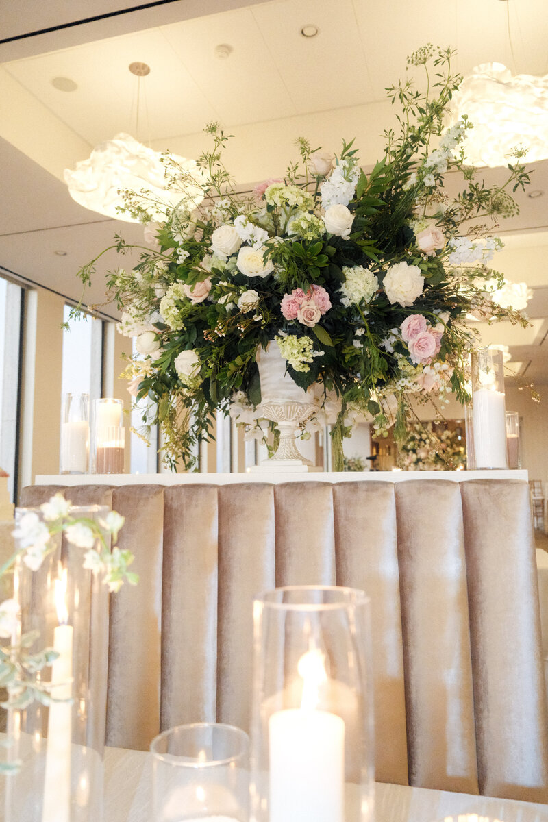 the Houston Club Wedding Venue, Luxury Wedding Decor with taupe banquet and blush urn florals