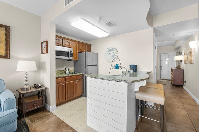 kitchenette with white shiplap bar