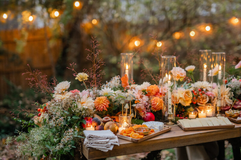 Fall-inspired tablescape with large flower center piece and candles
