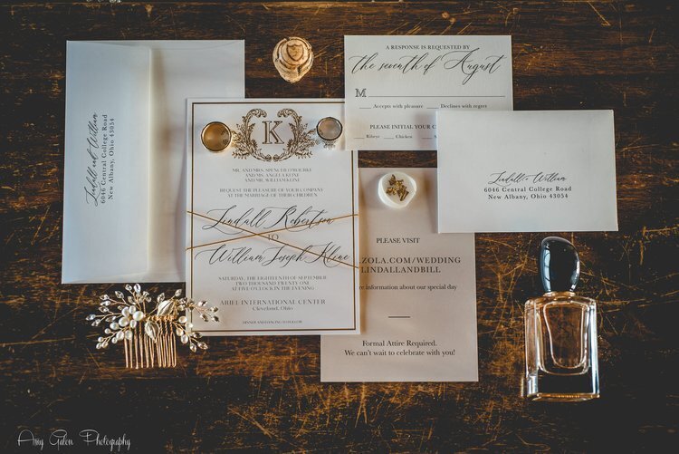 wedding invitations laid out on a table