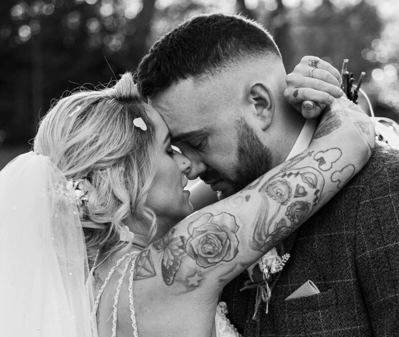 Bride Groom place foreheads together smiling