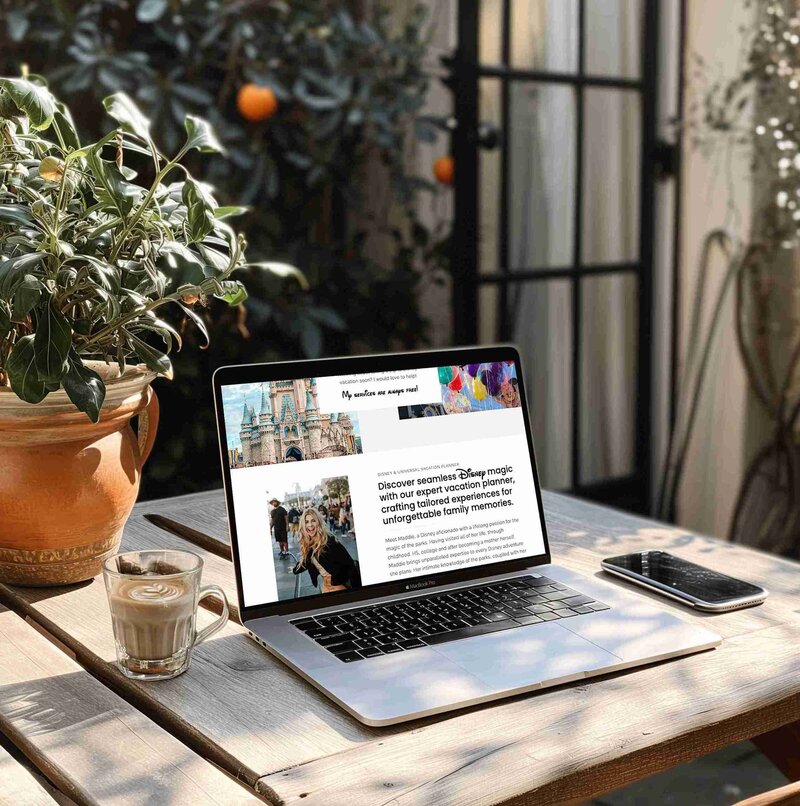 Cozy workspace featuring a laptop, a cup of coffee, and a plant, designed for a travel agent website by Unica Formo.