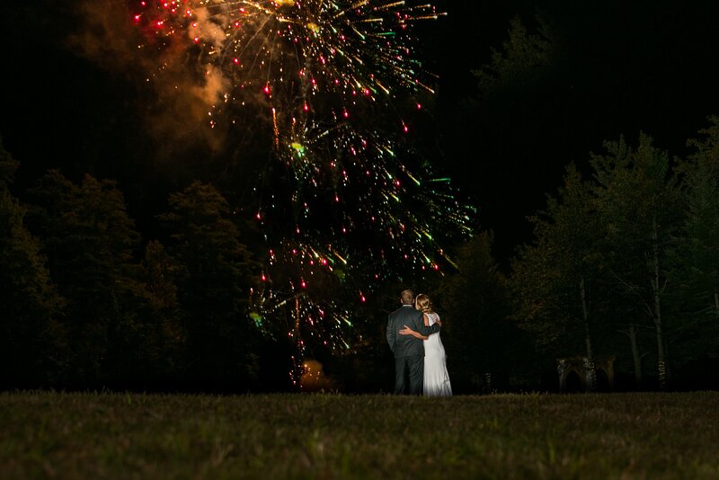 Bride and Groom watching fireworks at wedding | Klein Wedding at Grace on the Lake Venue taken by Maine Wedding Photographer