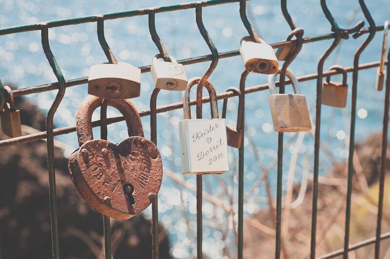 metallic love locks on bridge