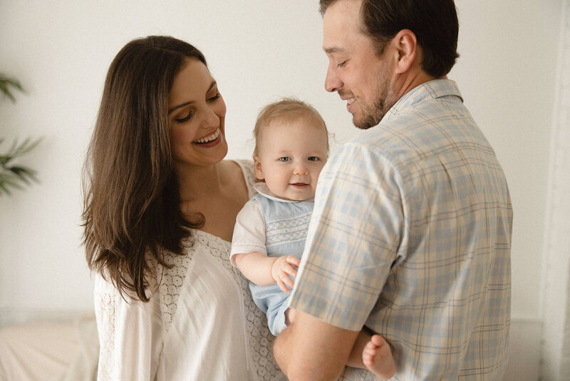 mom-and-dad-holding-baby