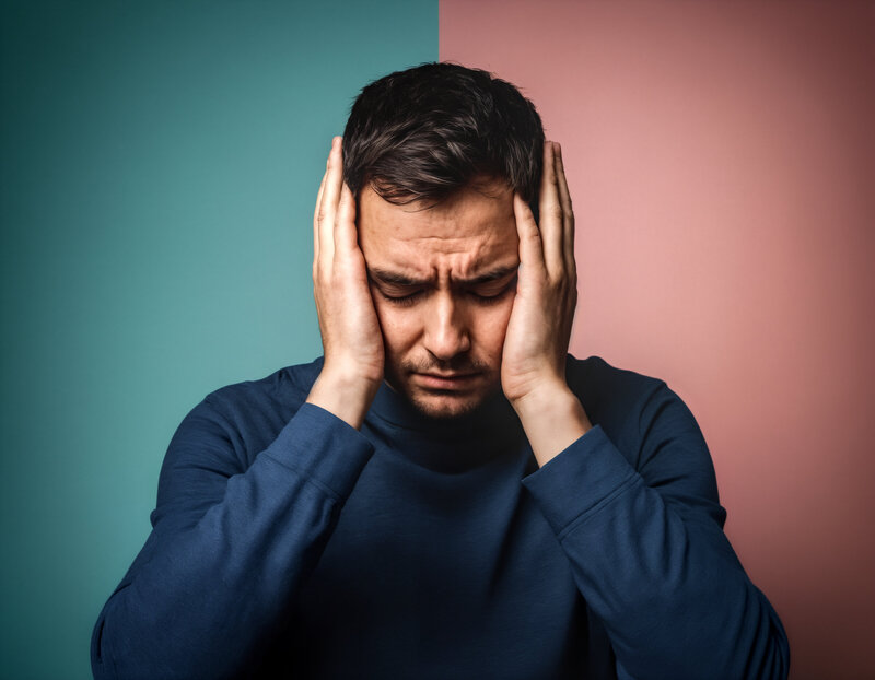 Man holding head mental health