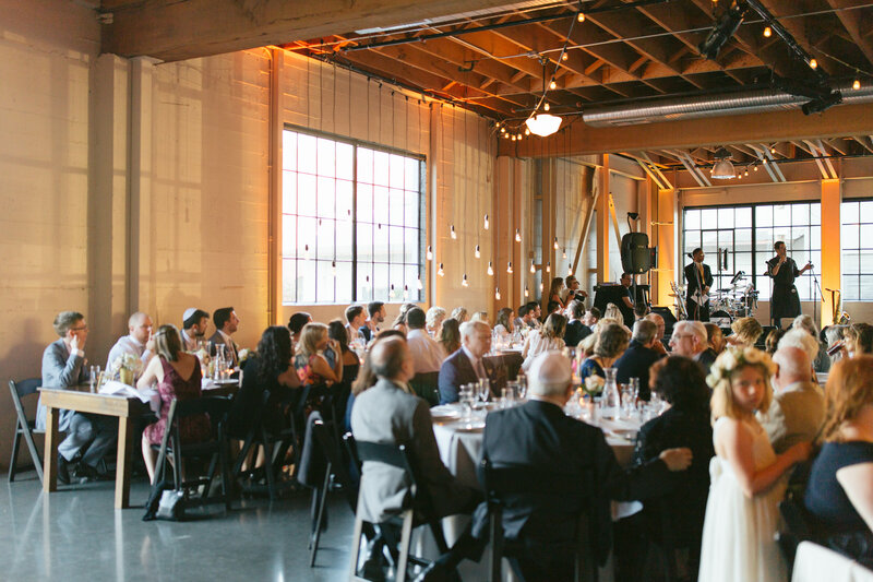 Guests admiring the live band at Castaway wedding in Portland Oregon.