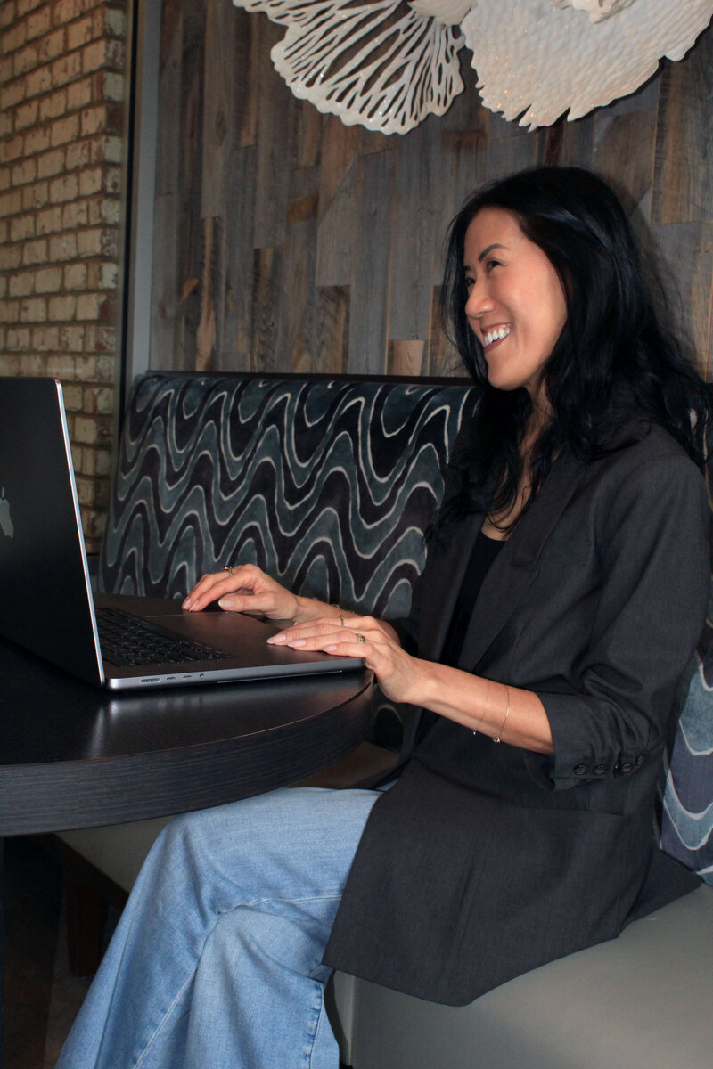 asian woman with laptop computer