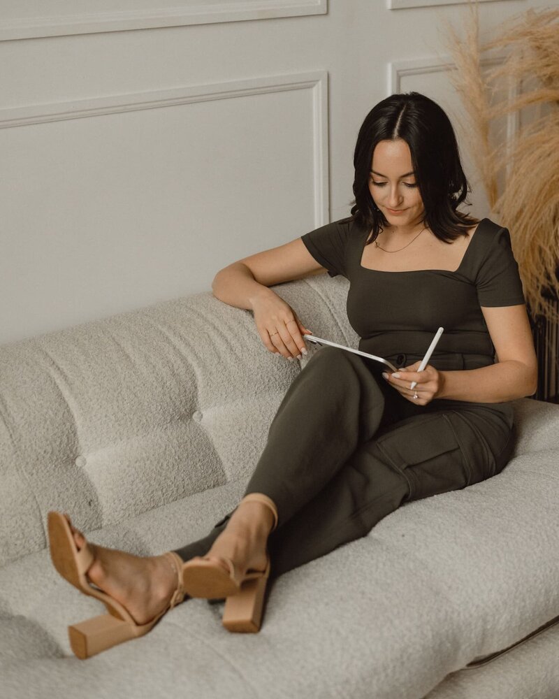 Wellness-focused web designer crafting strategic digital experiences using an iPad and Apple Pencil