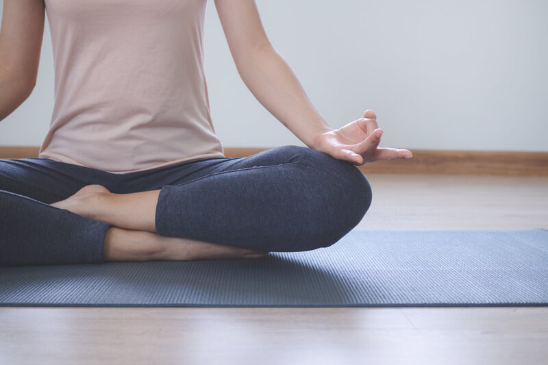 yoga-meditation-lifestyles-close-up-view-young-beautiful-woman-practicing-yoga-namaste-pose-living-room-home