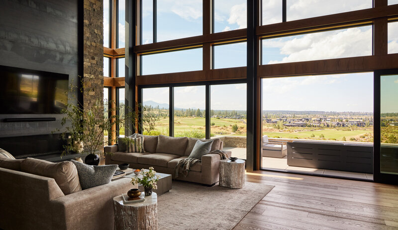 mountain-modern-home-living-room-window-wall-steel-panel-fireplace