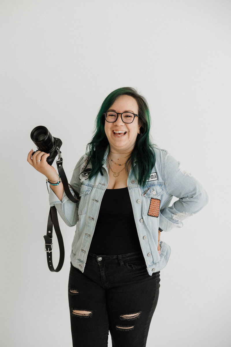 San Diego Birth Photographer holding camera smiling