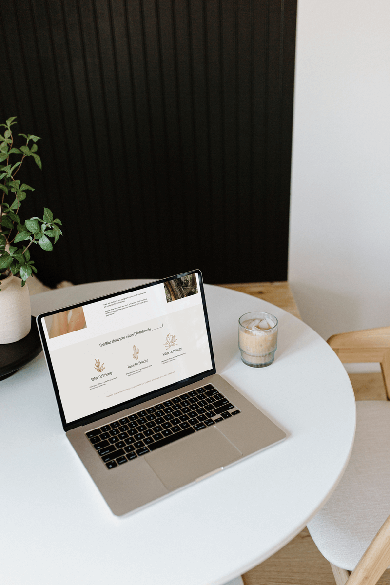 Laptop on table to show branding and web design for female entrepreneurs​ by Flourish Foundry Designs