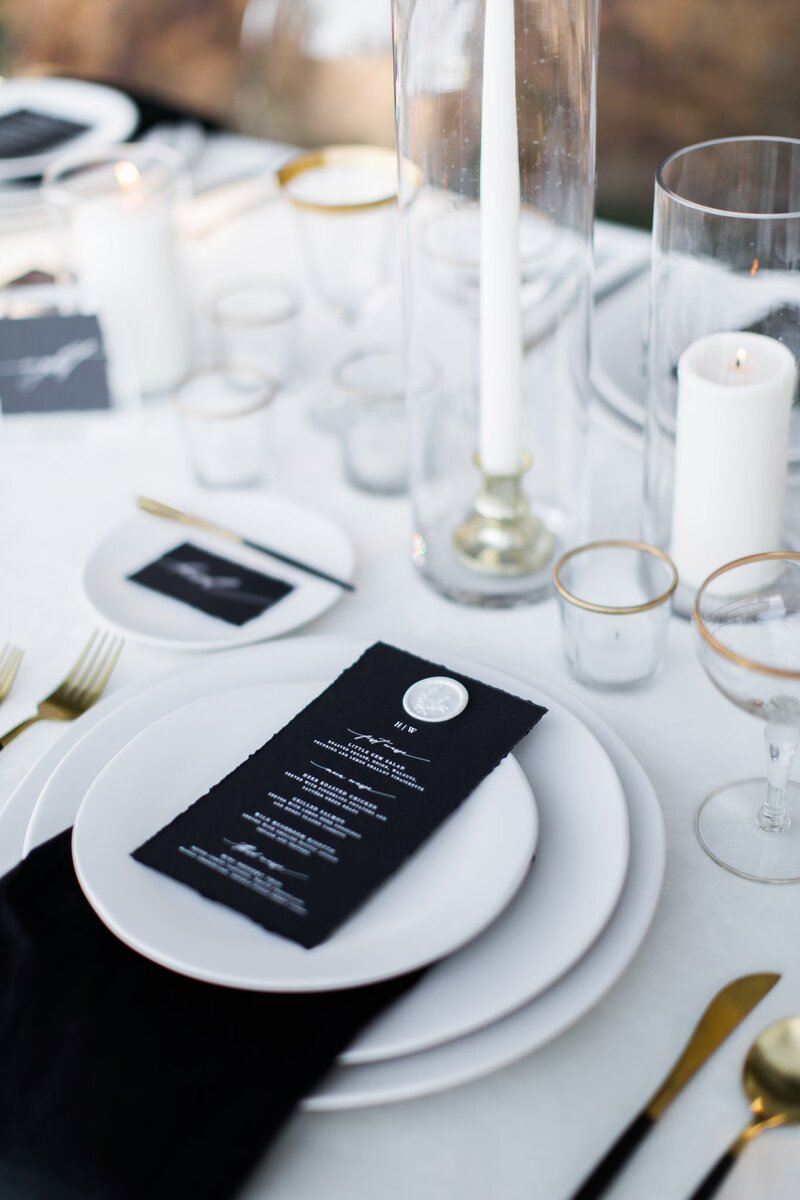 luxury wedding place setting with custom black menu