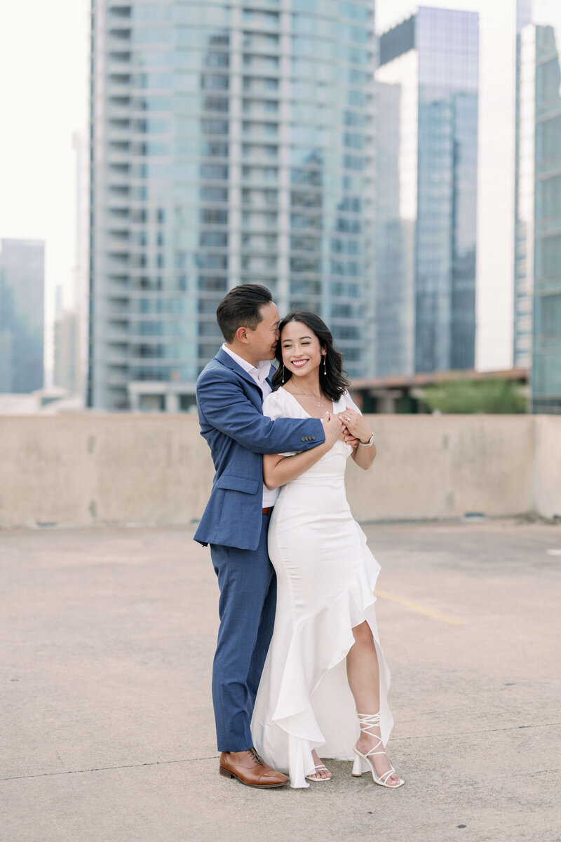 image of a happy couple hugging at Downtown Rooftop in Austin, Texas
