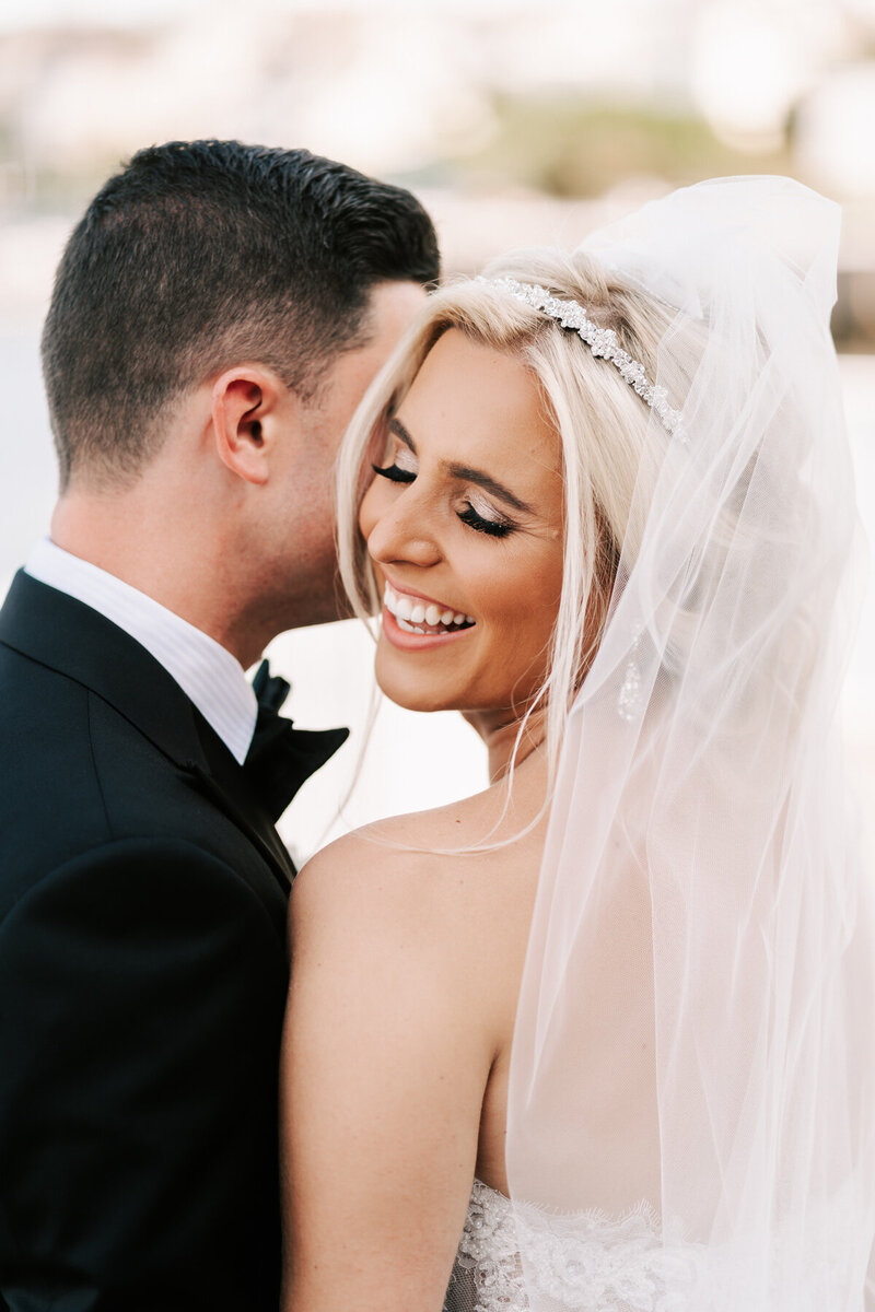 A bride laughing at her Molly Pitcher Inn wedding held in Red Bank, New Jersey