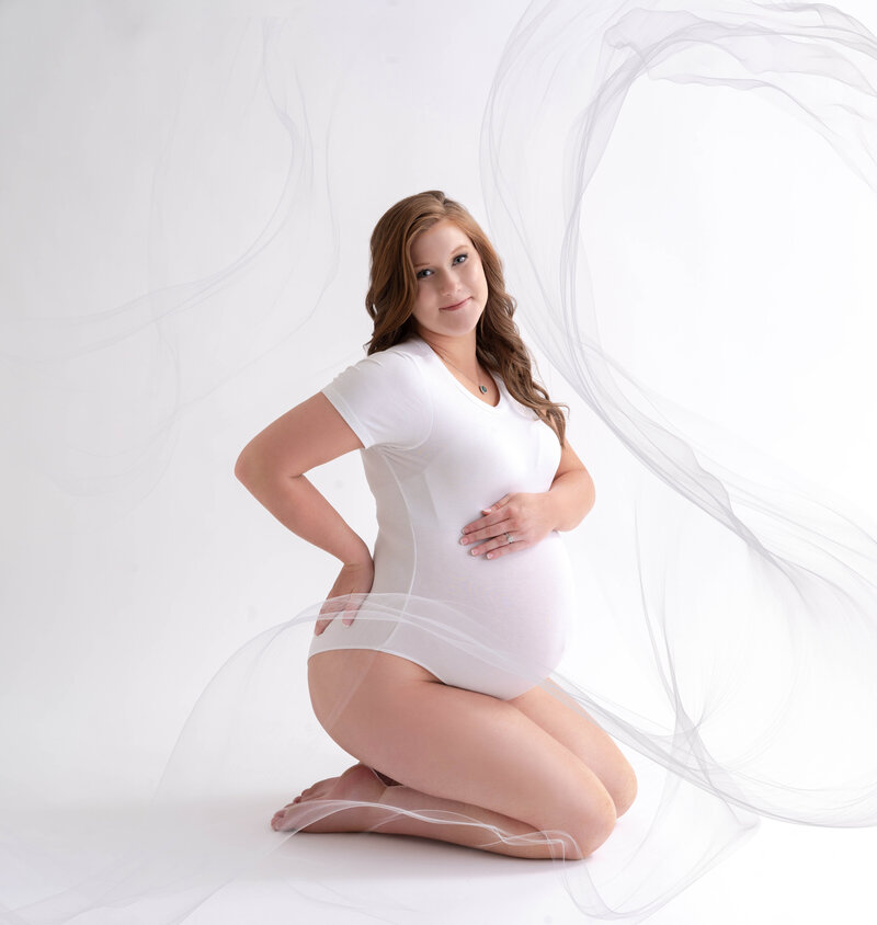 Pregnant woman in gown for maternity shoot in orlando